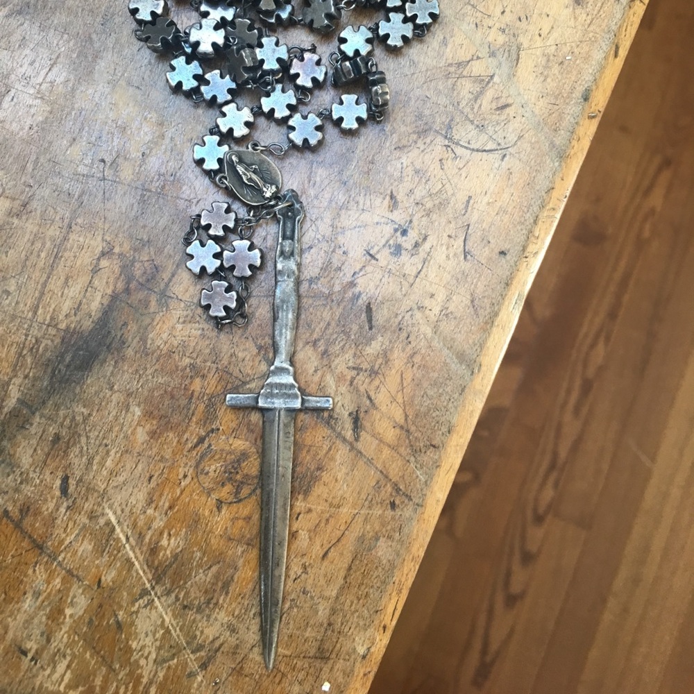 Pamela love Rosary cross and dagger